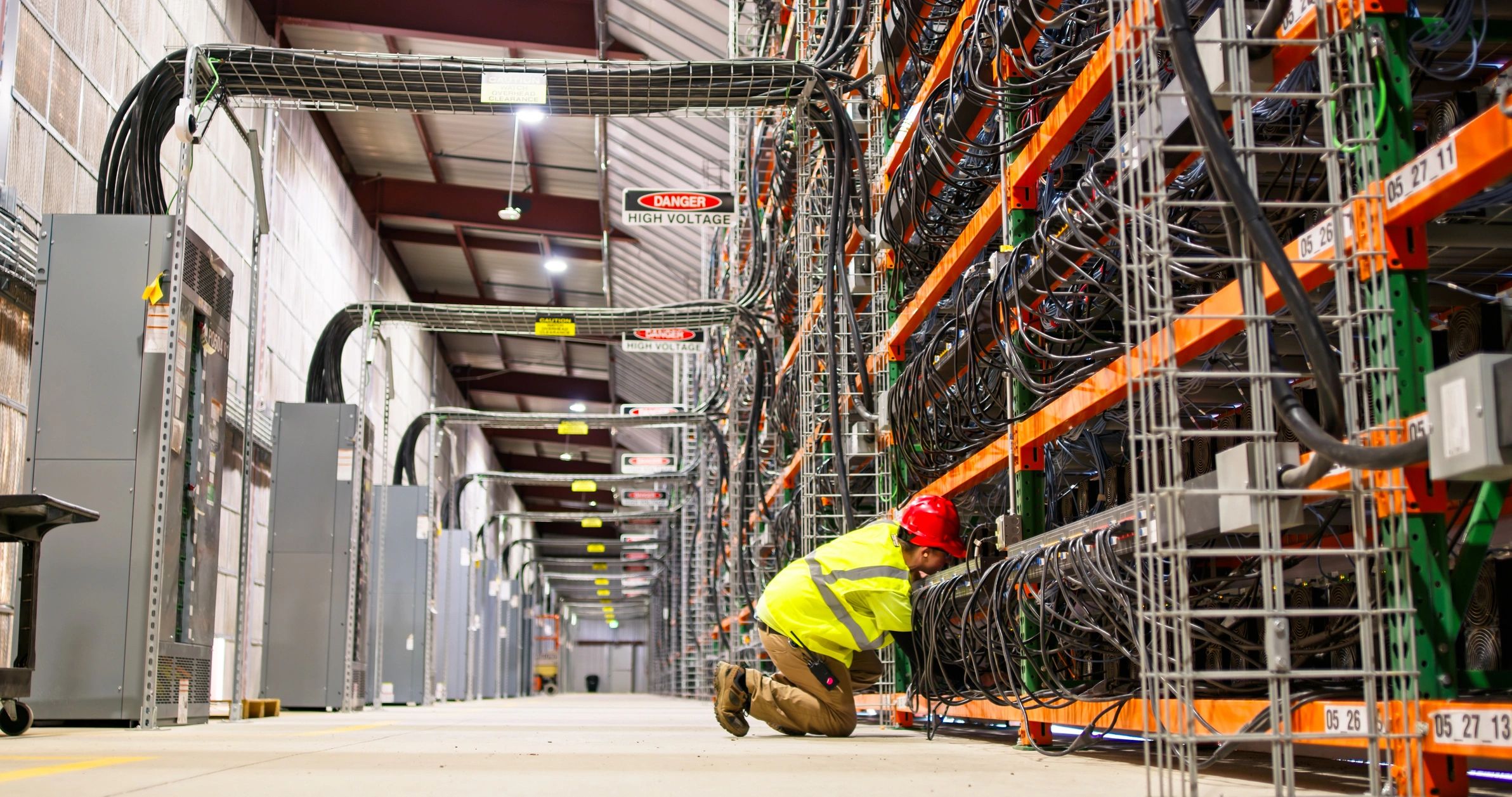 Technician working in a large data center environment